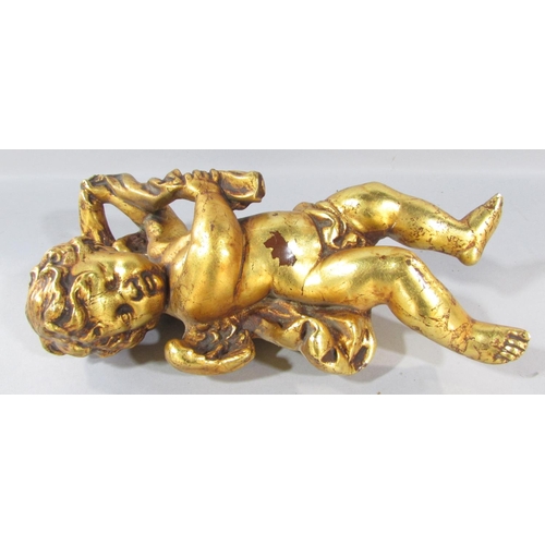 550 - A decorative gilt putti figure, a plaster putti wall plaque, a trumpet blowing winged cherub, furthe... 