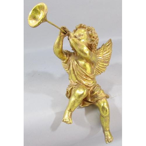 550 - A decorative gilt putti figure, a plaster putti wall plaque, a trumpet blowing winged cherub, furthe... 