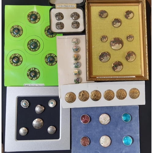 754 - A collection of mixed buttons all displayed on card or in frames, including a set of 9 Mother of Pea... 