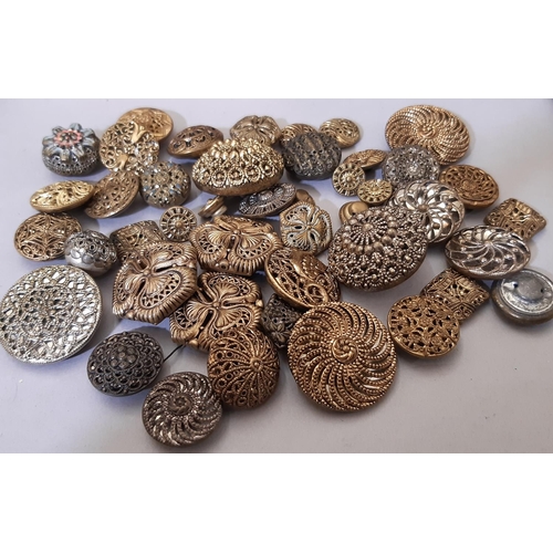 755 - A mixed collection of decorative buttons including Middle Eastern silver buttons, Austrian waistcoat... 