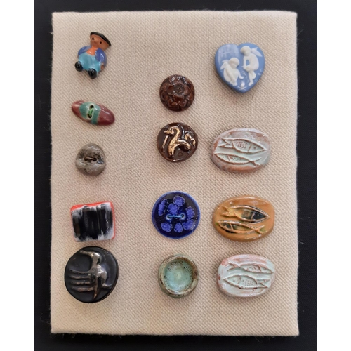 760 - A small collection of unmarked ceramic buttons including a green glazed round button 25mm possibly b... 