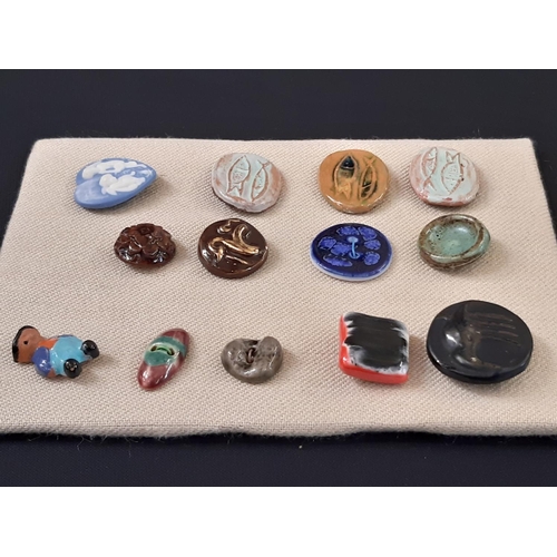 760 - A small collection of unmarked ceramic buttons including a green glazed round button 25mm possibly b... 