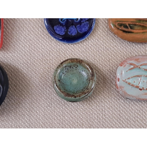 760 - A small collection of unmarked ceramic buttons including a green glazed round button 25mm possibly b... 