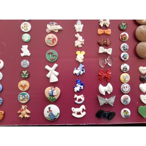 761 - A collection of 20th century novelty plastic buttons including buttons shaped as trains, planes, pet... 