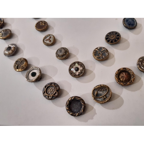 766 - A collection of 70 small metal Austrian Tinie buttons, late 19th to early 20th century, all 1 cm in ... 