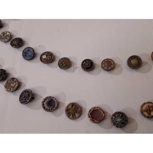 766 - A collection of 70 small metal Austrian Tinie buttons, late 19th to early 20th century, all 1 cm in ... 