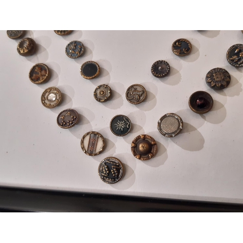 766 - A collection of 70 small metal Austrian Tinie buttons, late 19th to early 20th century, all 1 cm in ... 