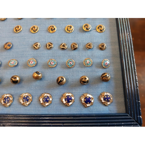 767 - A collection of late 19th to early 20th century small buttons comprising a framed display of enamell... 