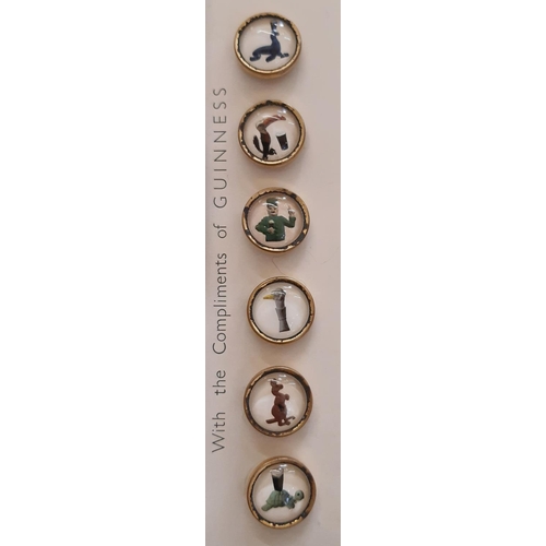 768 - A boxed set of 1959 Guiness waistcoat buttons each depicting characters from the John Gilroy adverti... 