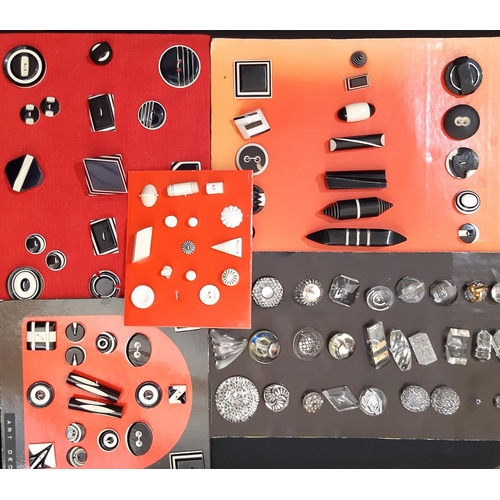 772 - A collection of vintage black and white Art Deco style buttons and toggles of various shapes and siz... 