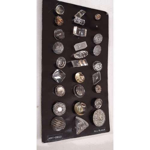 772 - A collection of vintage black and white Art Deco style buttons and toggles of various shapes and siz... 