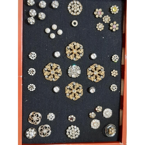 794 - A collection of antique and later crystal and paste buttons in various different settings and design... 