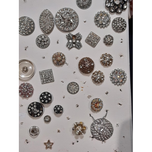 794 - A collection of antique and later crystal and paste buttons in various different settings and design... 