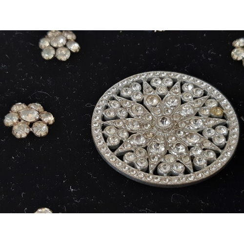 794 - A collection of antique and later crystal and paste buttons in various different settings and design... 