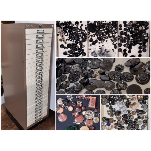 797 - A substantial collection of decorative19th - 20th century buttons housed in a 24-drawer lockable met... 