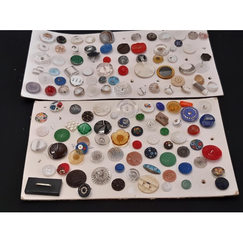 803 - A collection of 20th century decorative buttons in wood, horn, ceramic, plastic, glass etc displayed... 