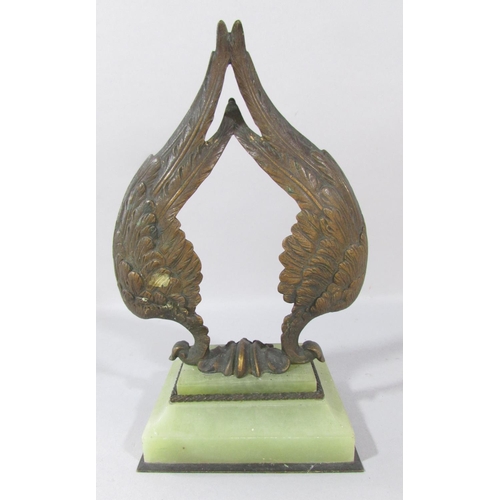 A Bronze Double Angel wing watch stand set on a green onyx base.