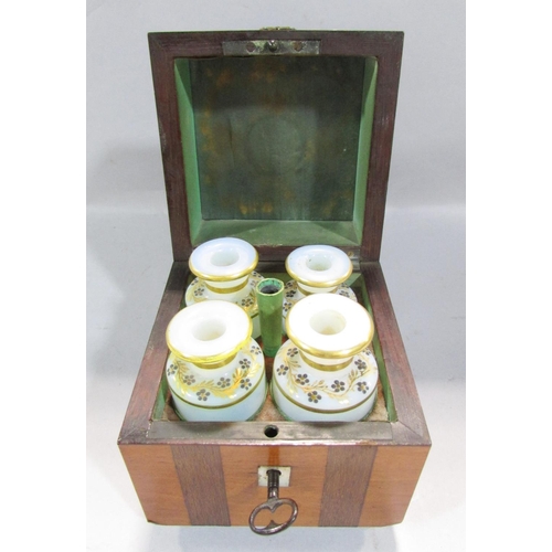 541 - A 19th century continental scent bottle box with a ring handle opening to reveal four opaque scent b... 