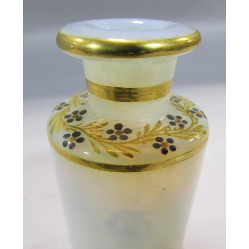 541 - A 19th century continental scent bottle box with a ring handle opening to reveal four opaque scent b... 