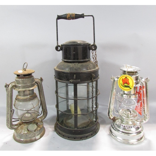 538 - A 19th century metal five glass panel storm lamp with a single candle holder, a later oil Hurricane ... 