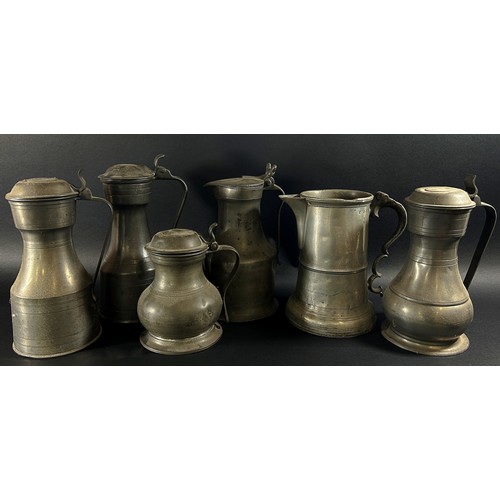 261A - Six assorted 19th century pewter jugs / tankards.