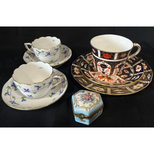 108 - A pair of Doulton Lambeth vases, a Crown Derby Imari pattern trio, A pair of Herend cups and saucers... 