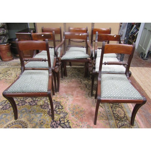 1360 - A set of eight (6+2) Regency sabre leg dining chairs with rope twist splats, drop in seats