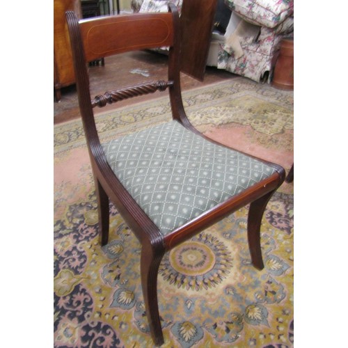 1360 - A set of eight (6+2) Regency sabre leg dining chairs with rope twist splats, drop in seats