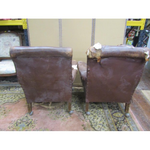 1362 - A pair of vintage leather club armchairs (for re-upholstery) (af)