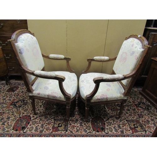 1363 - A pair of French open armchairs in walnut with acanthus and other detail