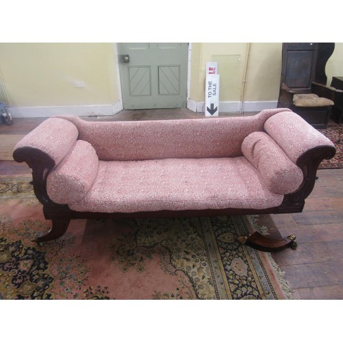 1367 - A Regency mahogany sabre leg settee with carved detail and later upholstered finish, 210cm long