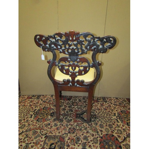 1374 - An early 19th century Anglo-Indian side chair the back with flamboyant carved detail, with drop in s... 