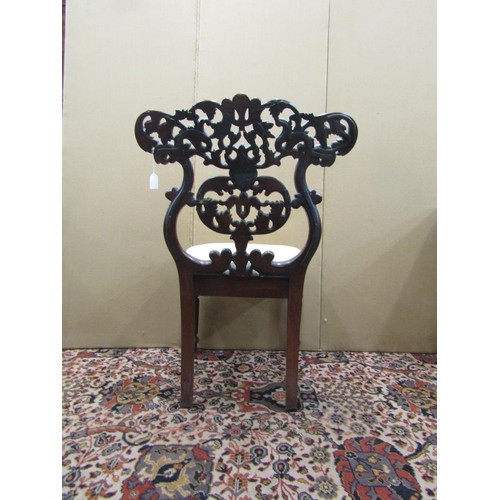 1374 - An early 19th century Anglo-Indian side chair the back with flamboyant carved detail, with drop in s... 