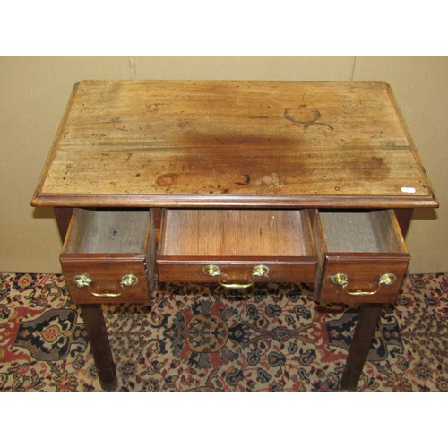 1377 - A Georgian three drawer mahogany lowboy with shaped apron, raised on moulded supports with brass swa... 