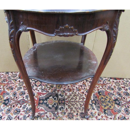 1465 - A Victorian rosewood centre table, the circular shaped outline raised on four shaped supports with u... 