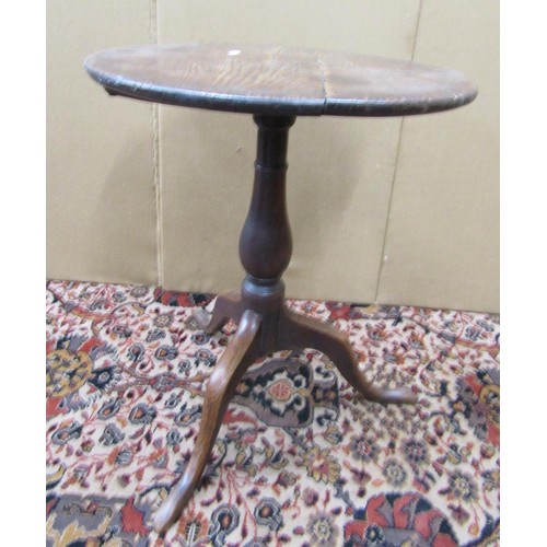 1474 - A Georgian cottage oak snap top table, the circular top 54cm diameter, raised on a turned pillar and... 