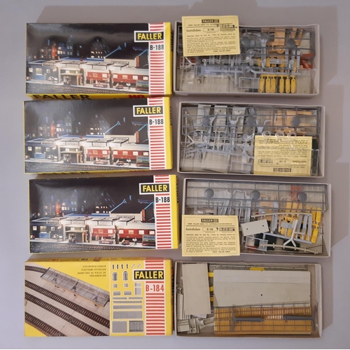 819 - 12 rail modelling kits of lineside buildings and accessories by Faller (11) and Aurora, all H0 gauge... 