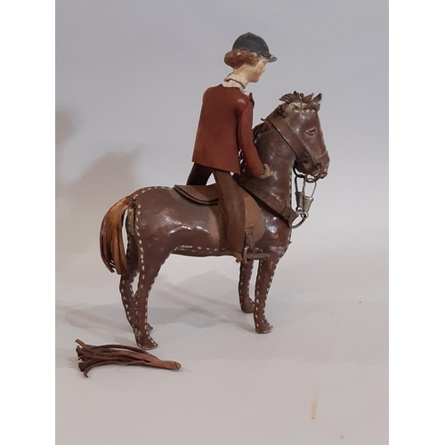 833 - Two 19th century  horse and rider leather toys comprising a white horse height 20cm with rider dress... 