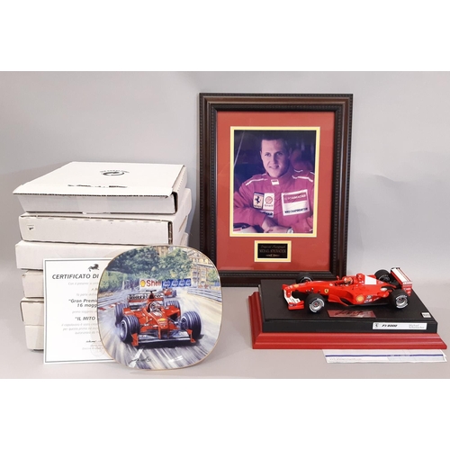 831 - Formula 1 interest: Michael Schumacher signed  2000 model car 1:18 scale  on plinth with purchase re... 