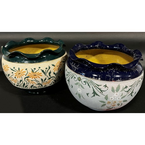 101 - Two Langley ware ceramic jardinières, one green/peach, the other blue/green, with repeating floral d... 