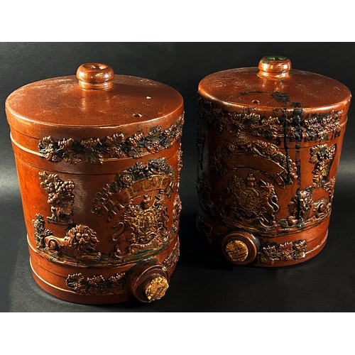 99 - A pair of salt glazed spirit barrels with applied royal cypher, lion and trailing vine leaf detail, ... 