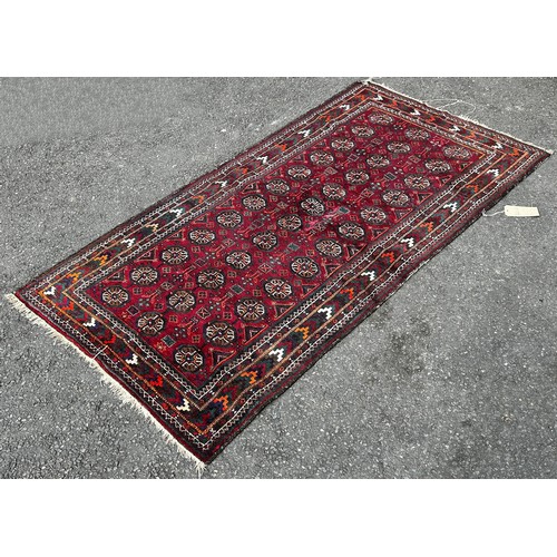 1494 - A small Persian prayer mat with an all over floral pattern, 130cm x 80cm, an old Bokhara carpet with... 