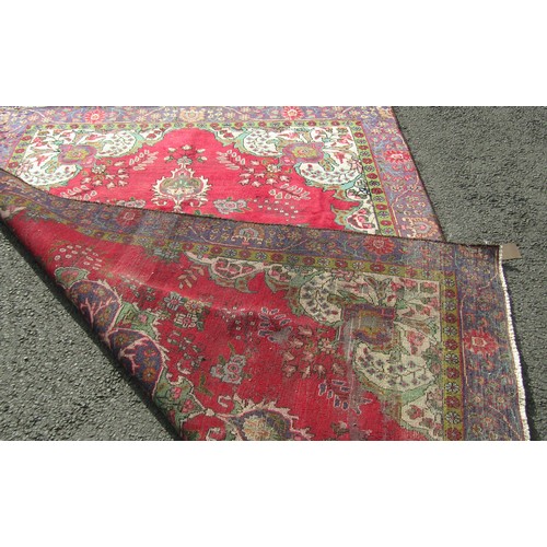 1504 - A vintage Persian Tabriz carpet with a multi coloured ground, 276cm x 189cm