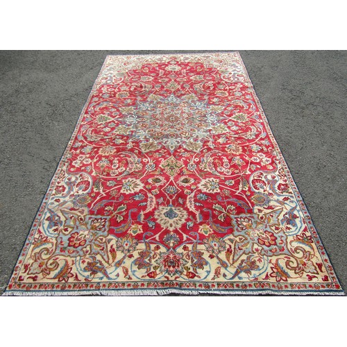 1511 - A vintage Persian Nafabad with all over floral design in reds and blues, 315cm x 174cm