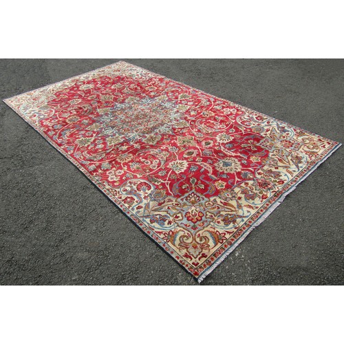 1511 - A vintage Persian Nafabad with all over floral design in reds and blues, 315cm x 174cm