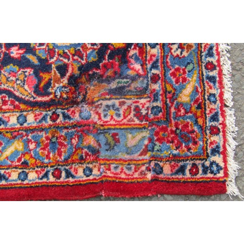 1514 - A Persian Kashan carpet with rich red ground and traditional floral medallion, 393cm x 300cm