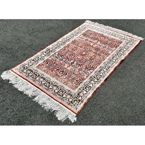 1498 - A silk Bidjar design carpet with an all over floral pattern and floral borders, 190cm x 120cm