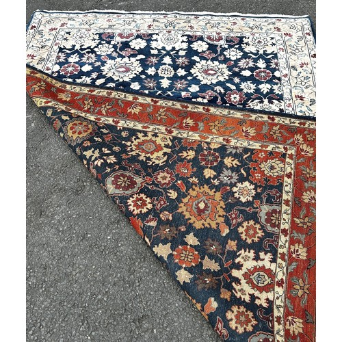 1501 - A Serapi type carpet with a large floral design on a blue ground, 220cm x 160cm.