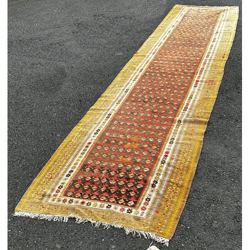 1502 - An old Northwest Persian Kilim runner, with a central panel of small geometric botehs,  482cm x 101c... 