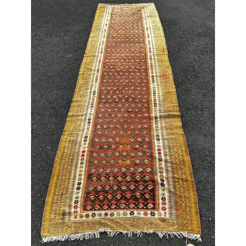 1502 - An old Northwest Persian Kilim runner, with a central panel of small geometric botehs,  482cm x 101c... 